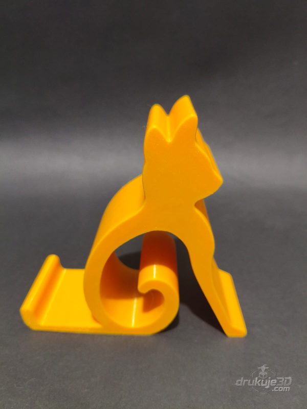 Żółta podstawka pod telefon w kształcie sylwetki siedzącego kota, wydruk 3D z PETG Żółta podstawka pod telefon w kształcie sylwetki siedzącego kota, wydruk 3D z PETG