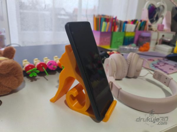 Żółta podstawka pod telefon w kształcie sylwetki siedzącego kota, wydruk 3D z PETG Żółta podstawka pod telefon w kształcie sylwetki siedzącego kota, wydruk 3D z PETG